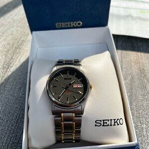 Seiko titanium men's watch with gold trim